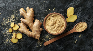 Whole, sliced and powdered ginger sitting on a table